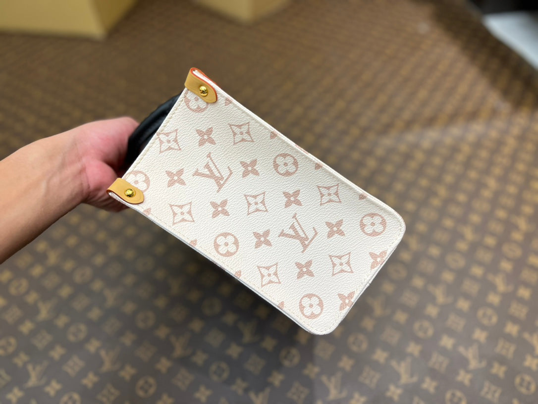 onthego pm 25 cream monogram empreinte embossed calfskin bagcharm